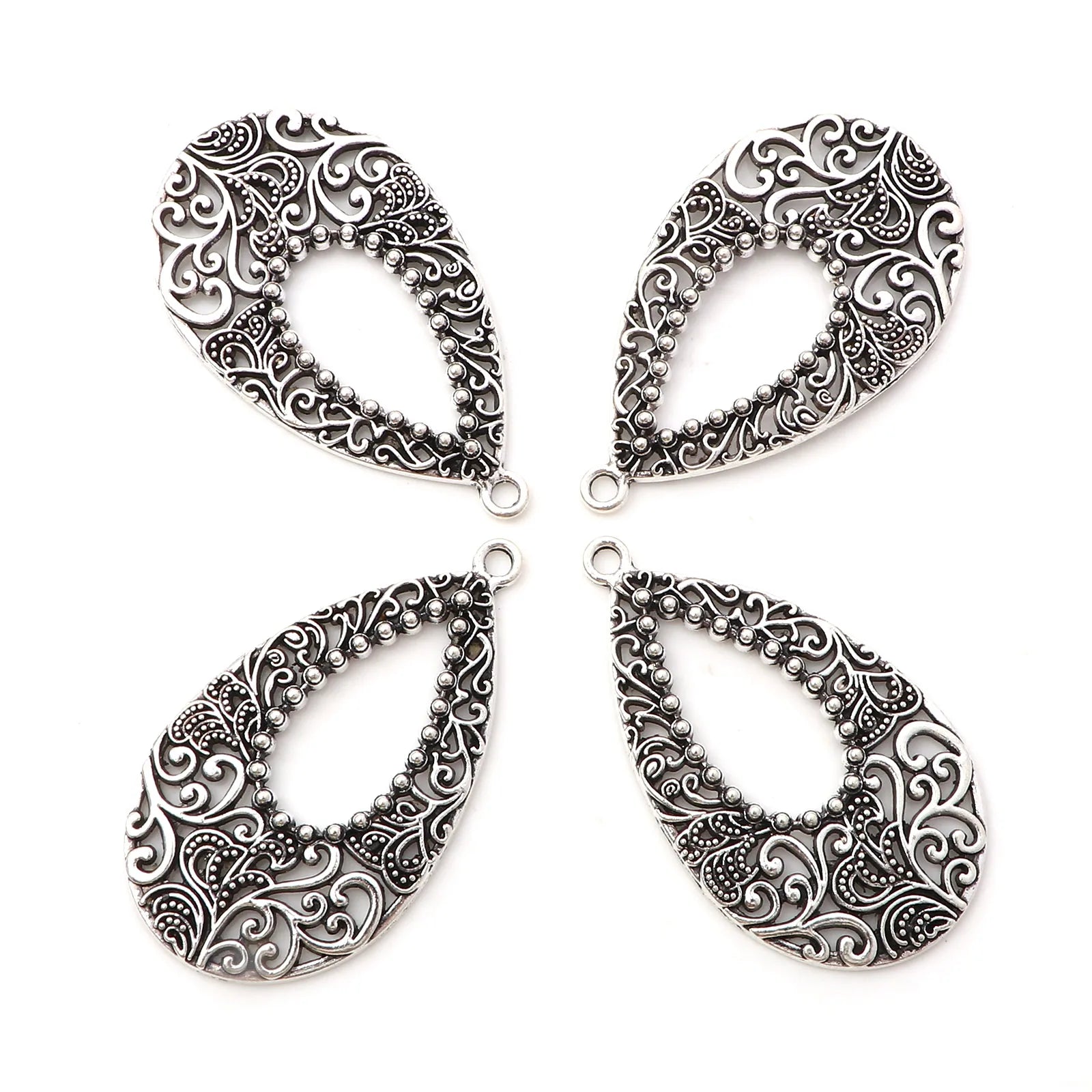 Pendentifs vintage ajourés en métal couleur argent - e-thnic